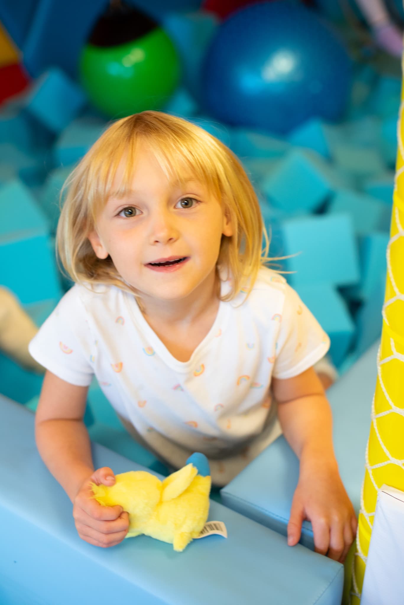 Child engaging in a foam sensory play environment at Sensory Escape